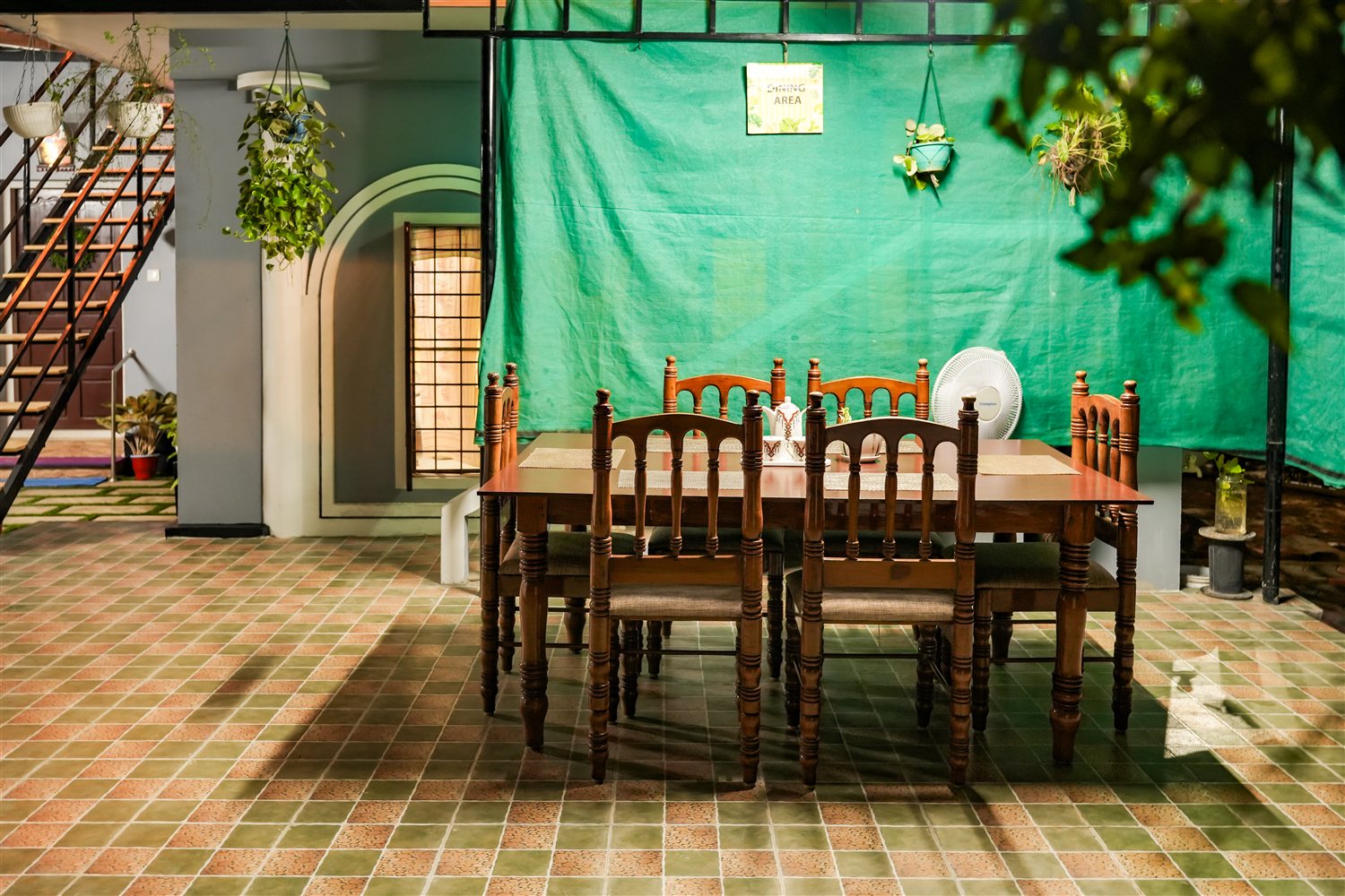 Outdoor garden dining area at Nello's Home Stay